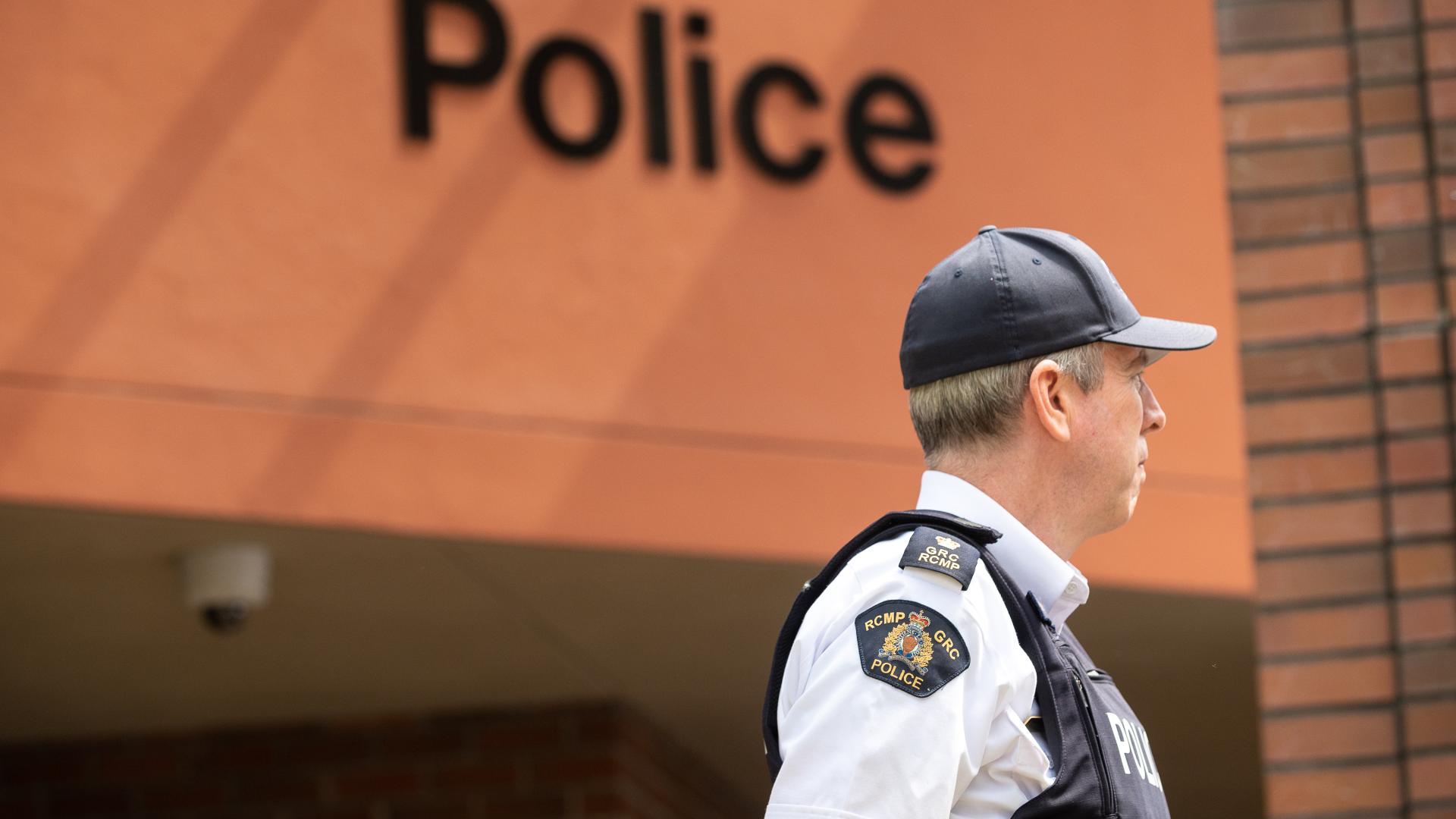 RCMP officer standing in front of the policy station