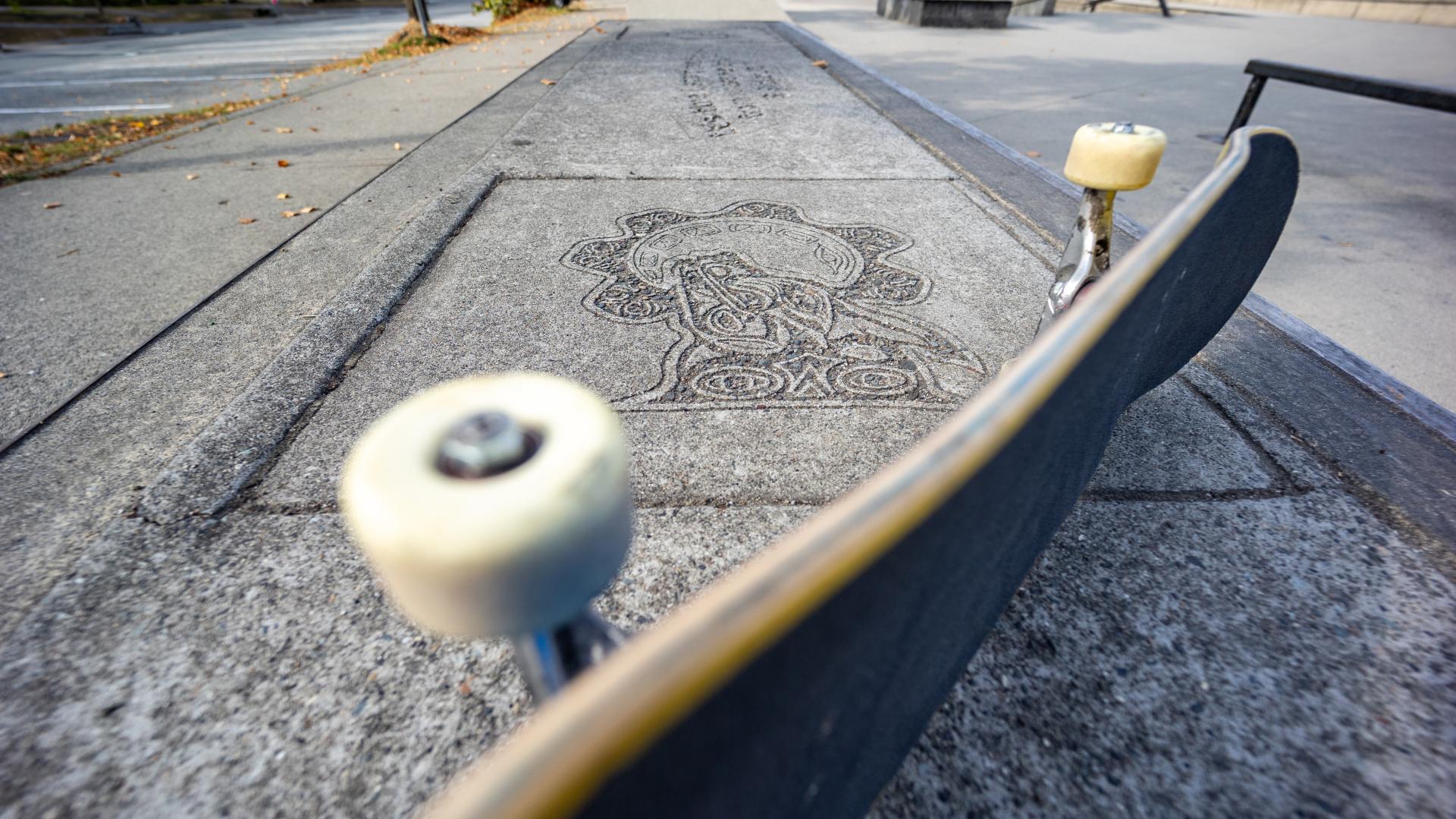 Skateboard with Public Art in the Sidewalk