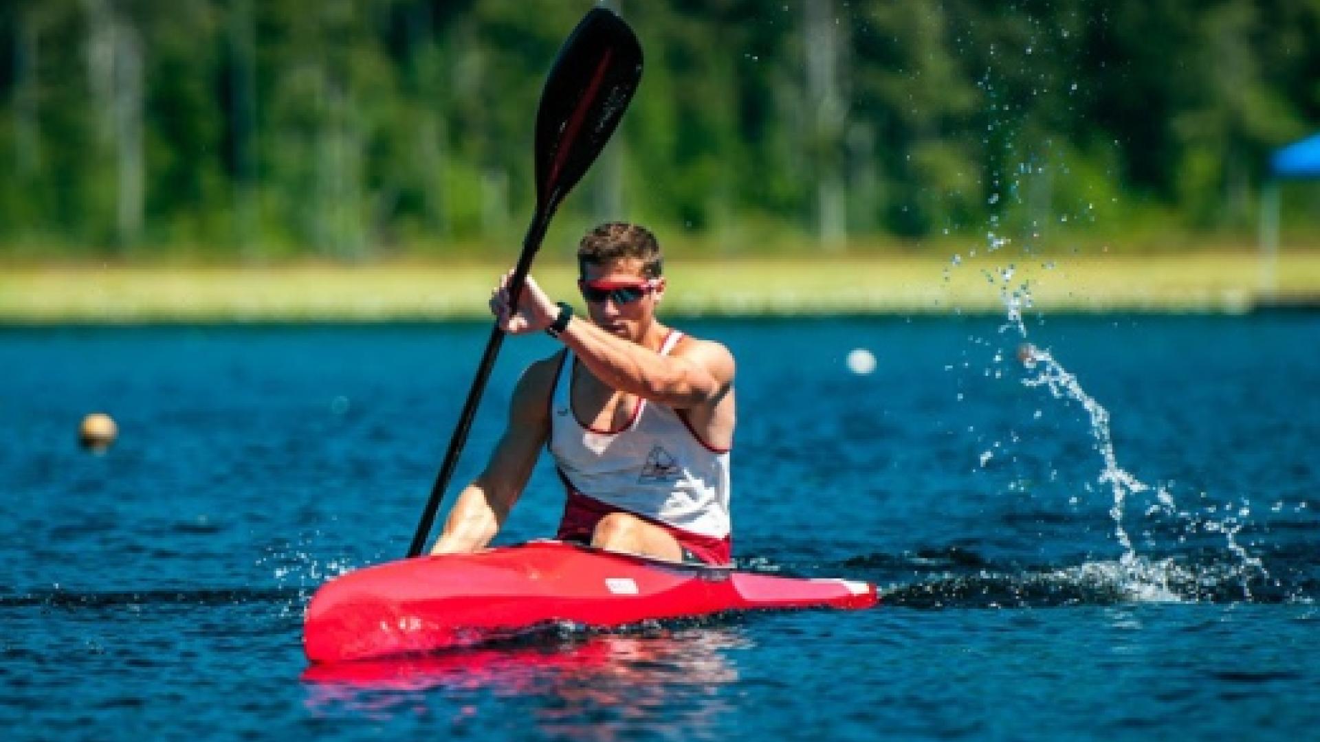 Brian Malfesi kayaks across a lake.