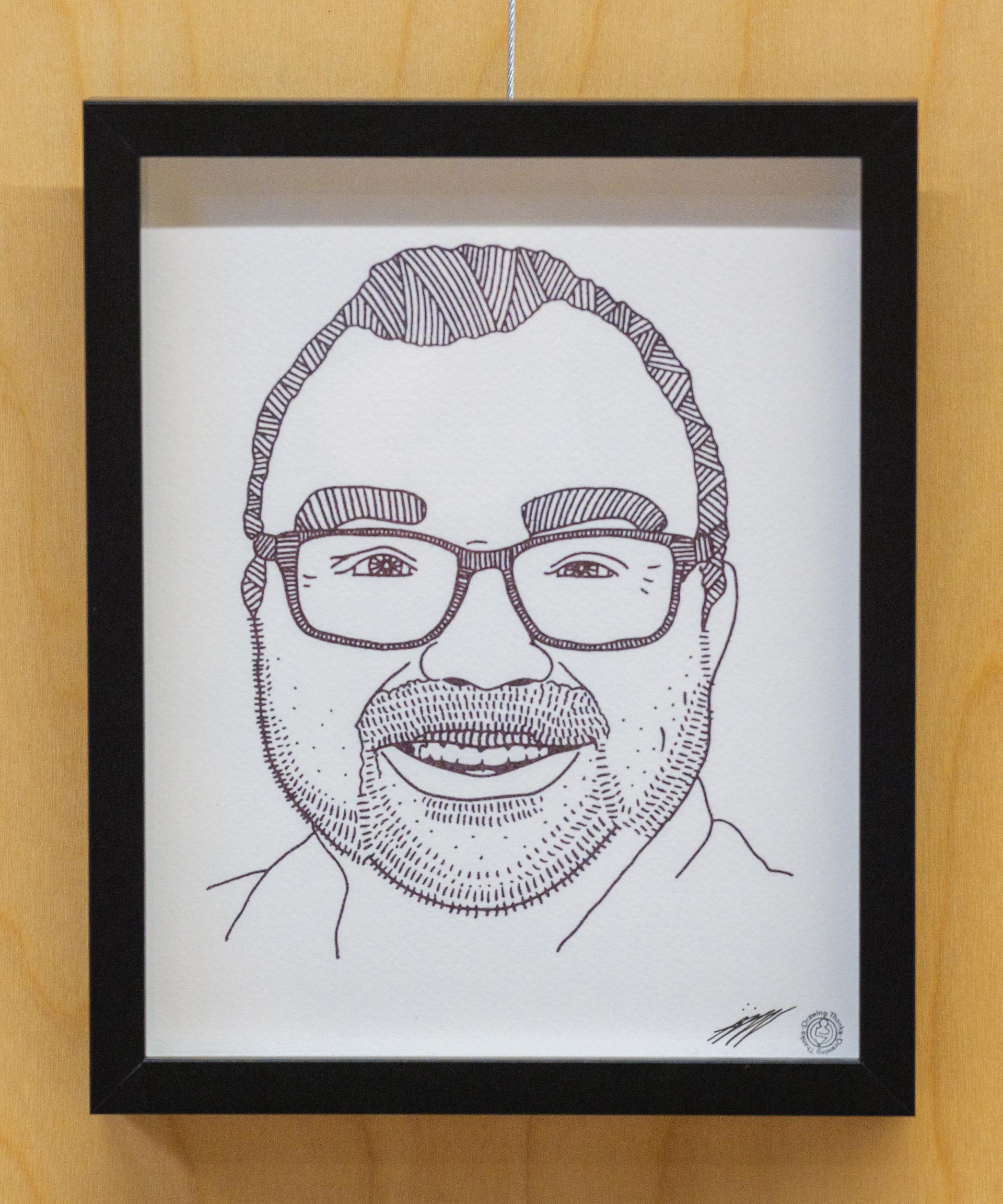 A portrait of a smiling man as part of the Constellation art installation by Alex Neff.