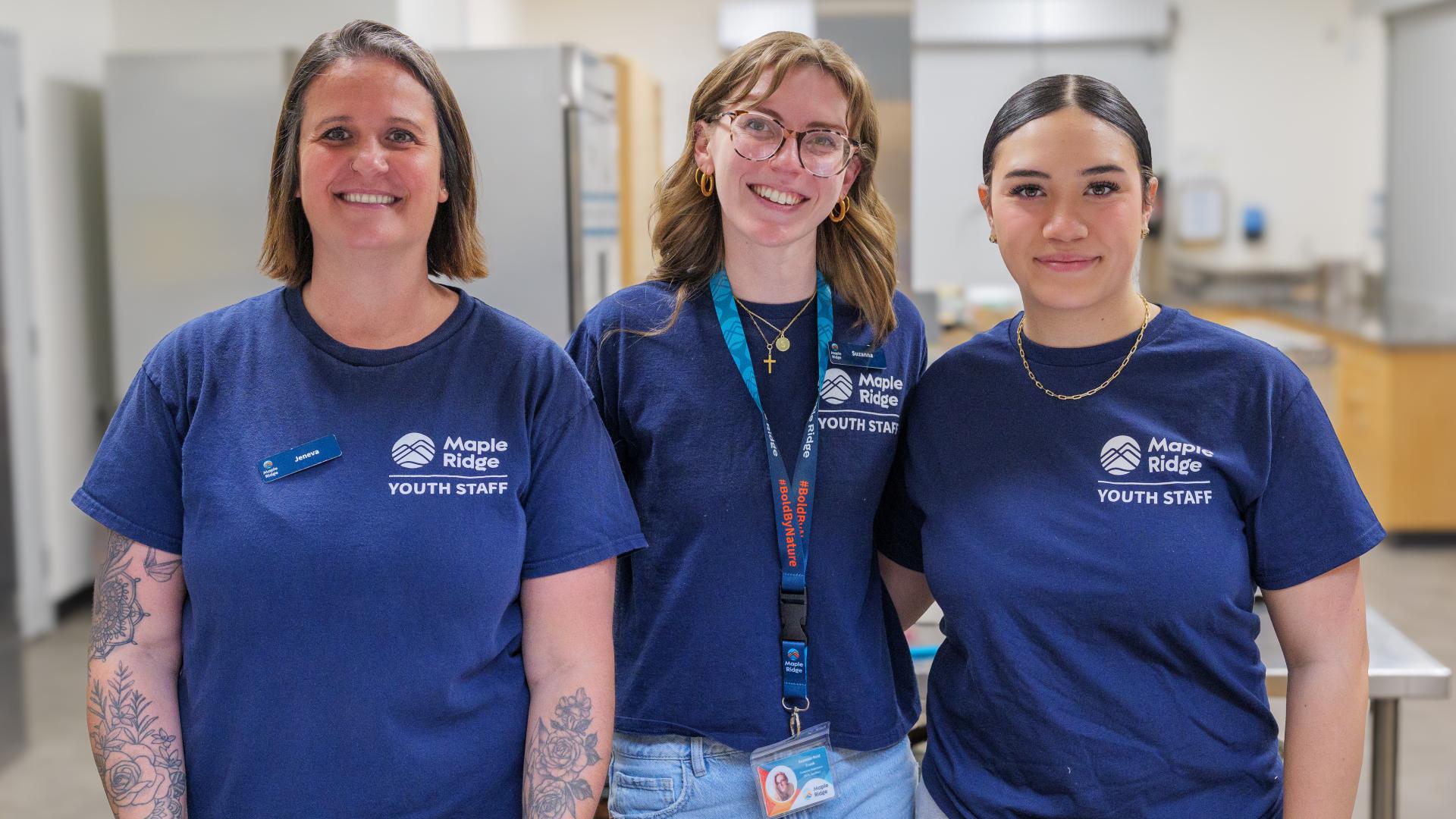 Three Youth Staff Standing Together