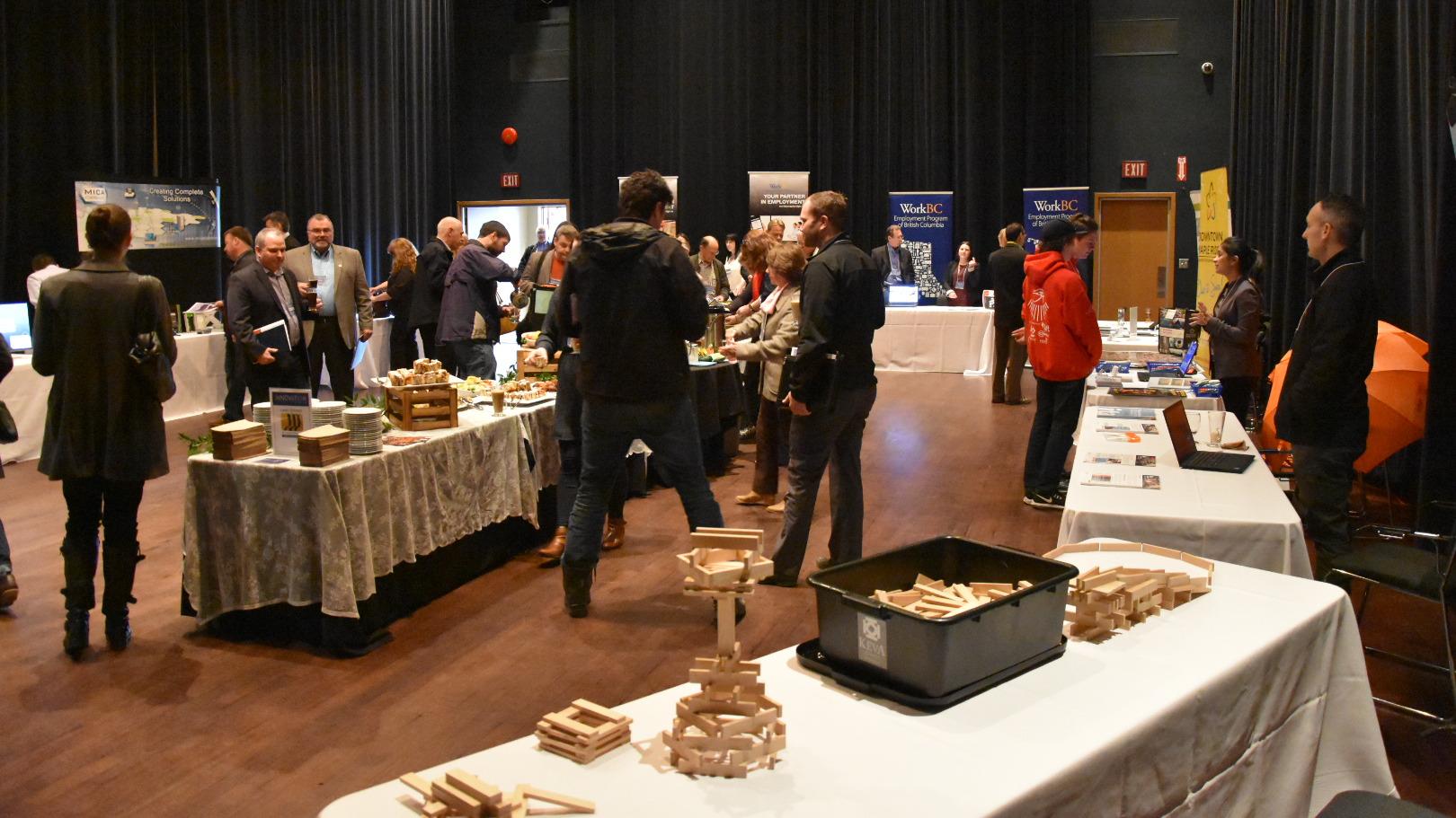 A crowd peruses the displays in the Maple Ridge ACT's Art Centre's studio theatre.