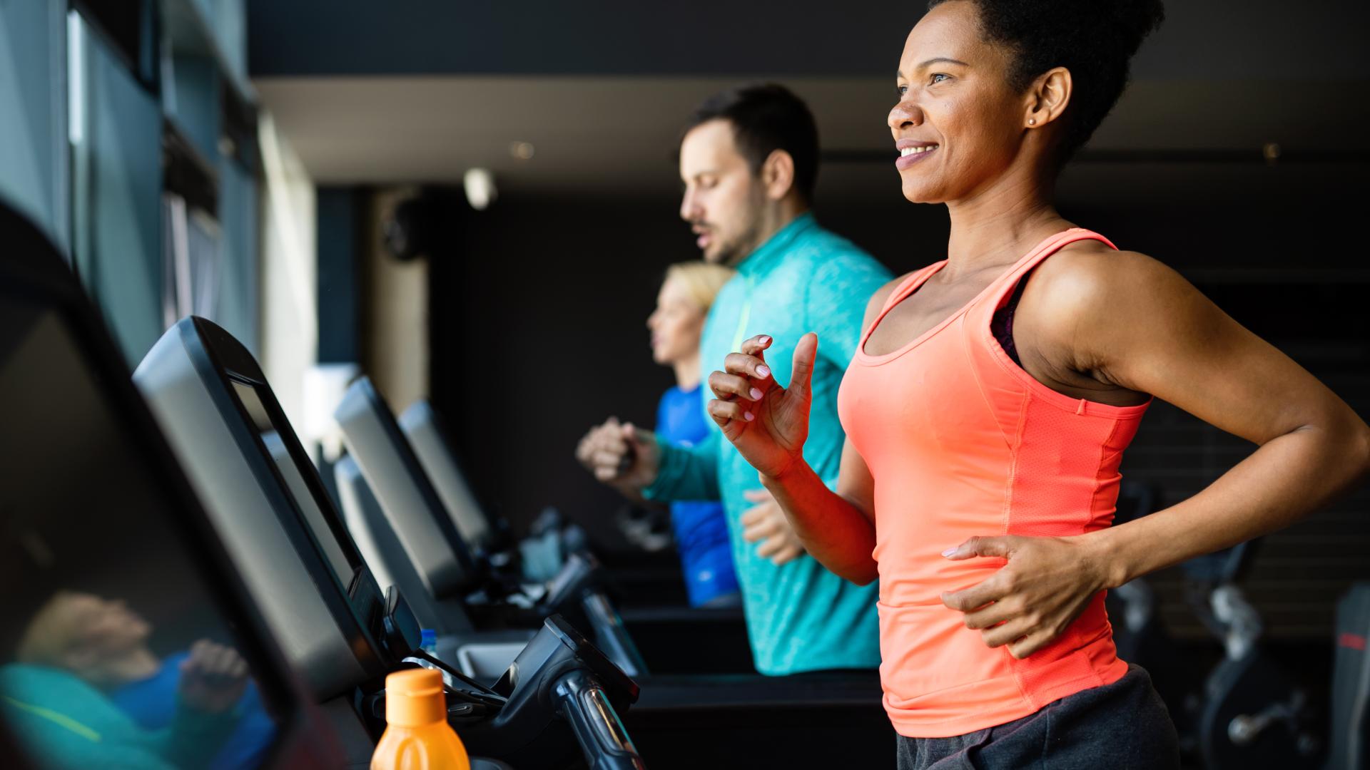 Men and Women in a Gym Running on a Treadmill