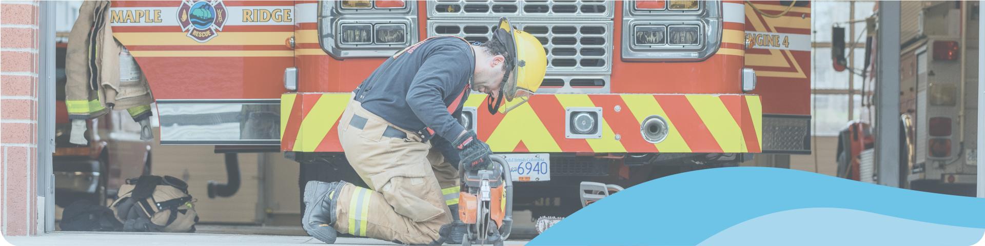 fire fighter in front of the fire truck