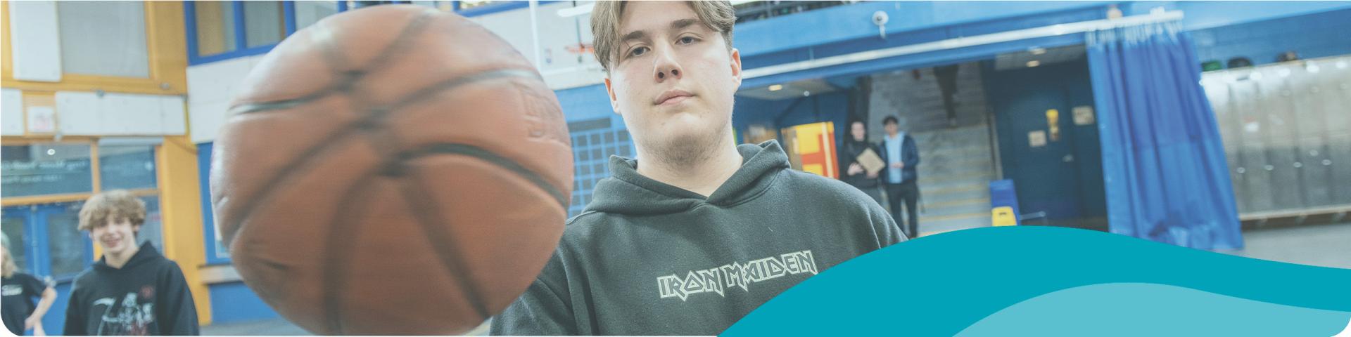 young man with a basketball ball