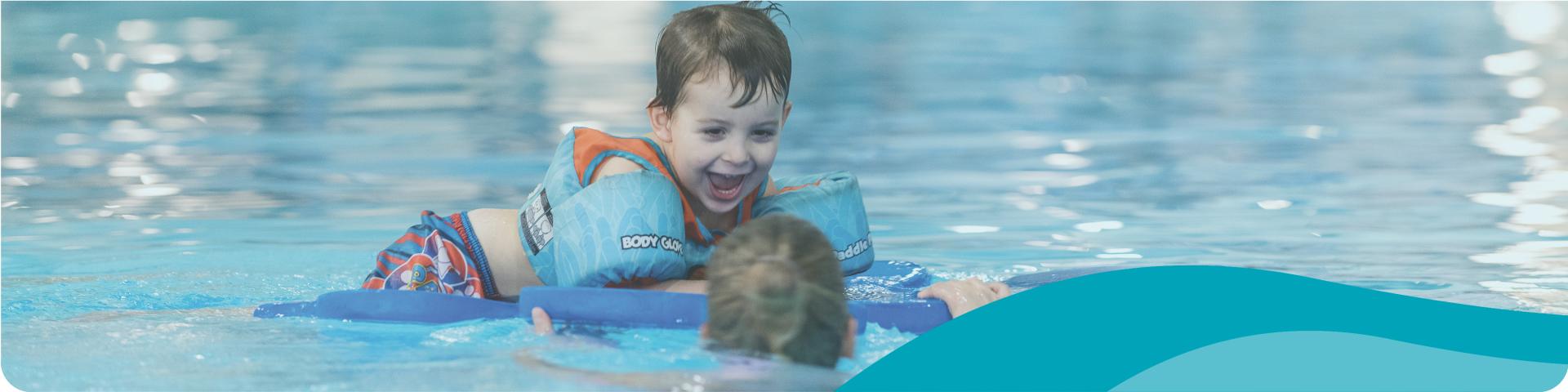 child laughing in the swimming pool