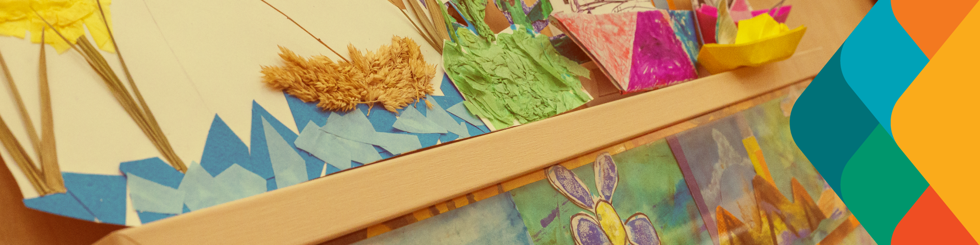 A multi-media piece of art featuring various kinds of paper both in and out of the wooden frame, hangs on a wall.