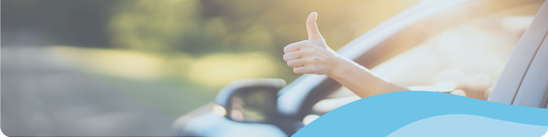 man showing a thumb up from the car window