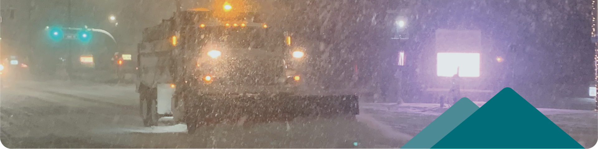 snow plow removing snow from the road